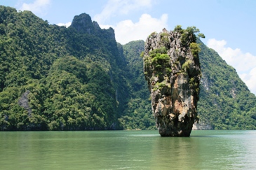 In keeping with our penchant for finding and featuring the unusual, we have selected the small, but distinctive James Bond Island in Phuket, Thailand to represent the Islands' unltd.com site.  The island, which was originally known locally as Ko Tapu or Nail Island, found fame after the James Bond film "The Man with the Golden Gun" was released in the 1970s.  Hence, the name change.  Although, more a topographical freak of nature, it still qualifies as a bona fide island and is considered a major Thai tourist attraction.  Photo by Australian photographer "Colleen T".